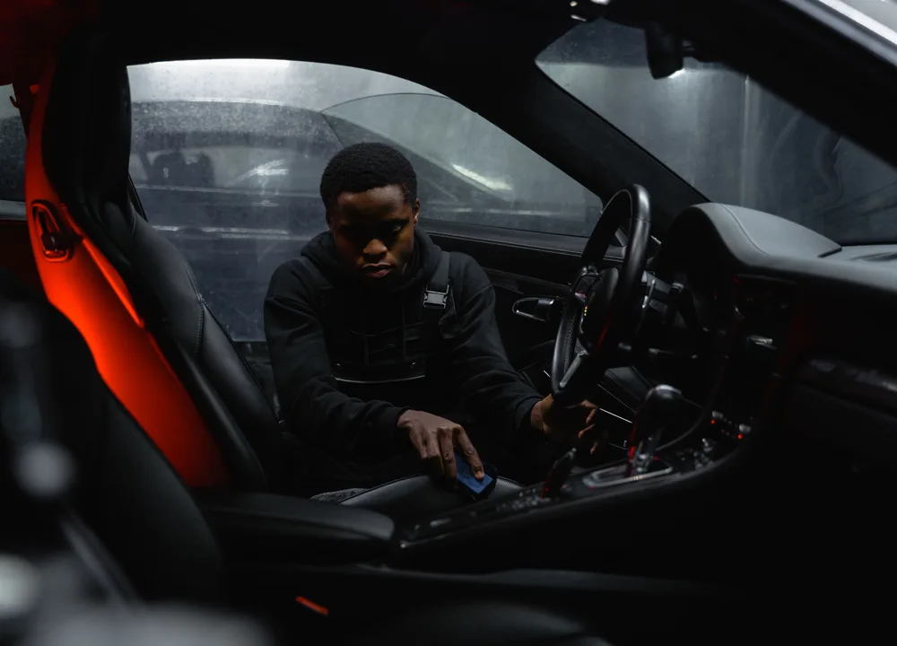 Luxury car interior being professionally detailed