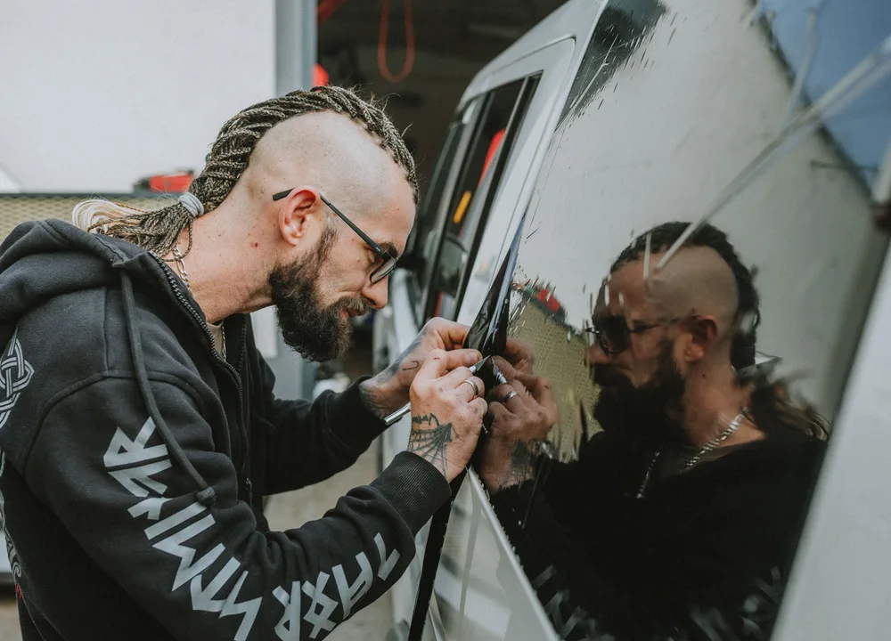 Technician installing premium window tint