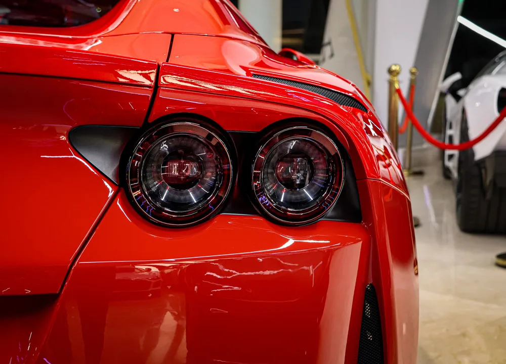 Deep gloss on a red performance car after correction